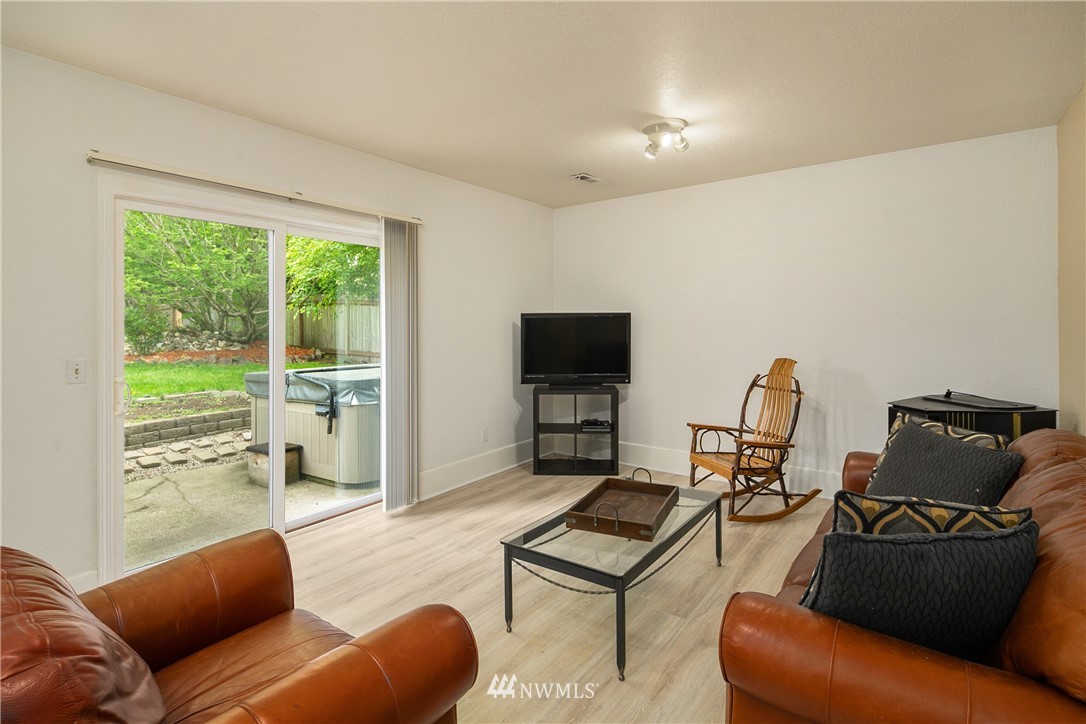 2329 169th Place Southeast Bothell, WA 98012 - Photo 13 of 18 a living room with furniture and a flat screen tv
