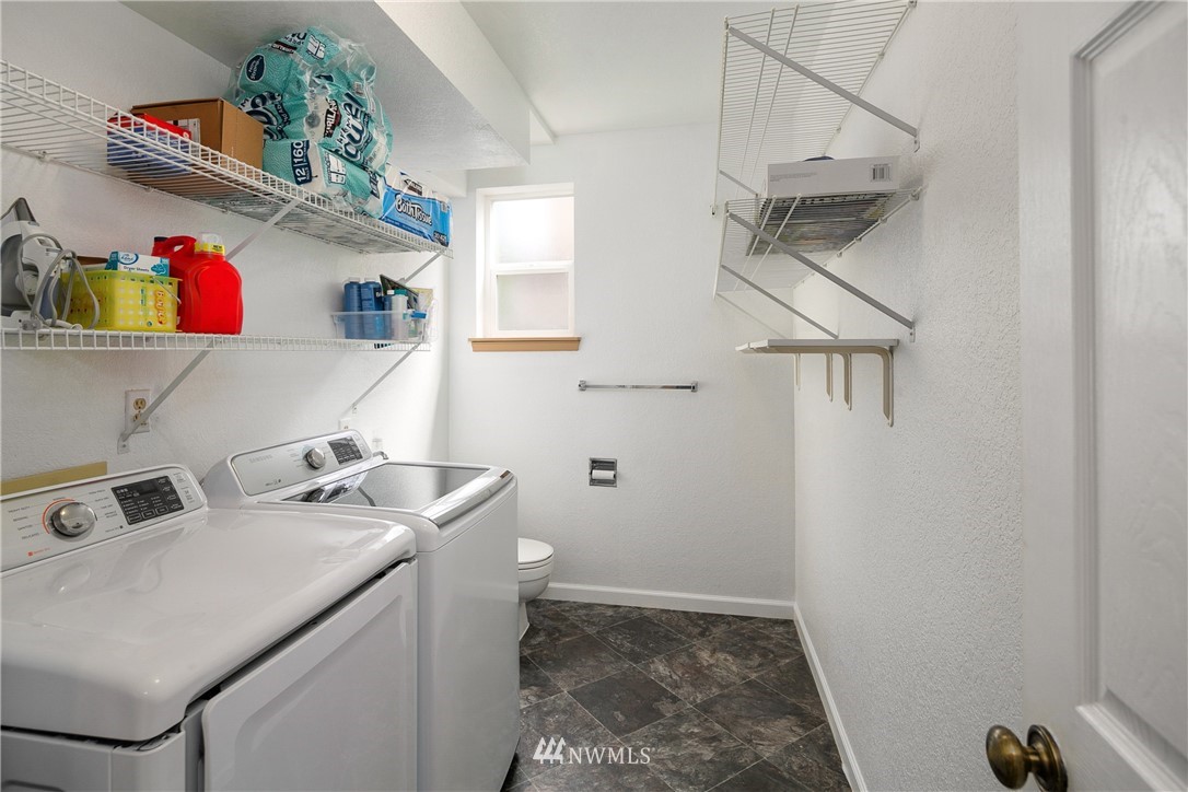 2329 169th Place Southeast Bothell, WA 98012 - Photo 14 of 18 a utility room with dryer and washer