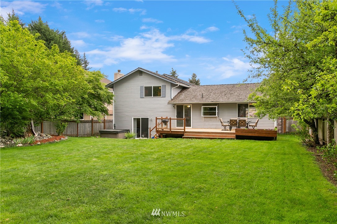 2329 169th Place Southeast Bothell, WA 98012 - Photo 15 of 18 a front view of a house with a garden