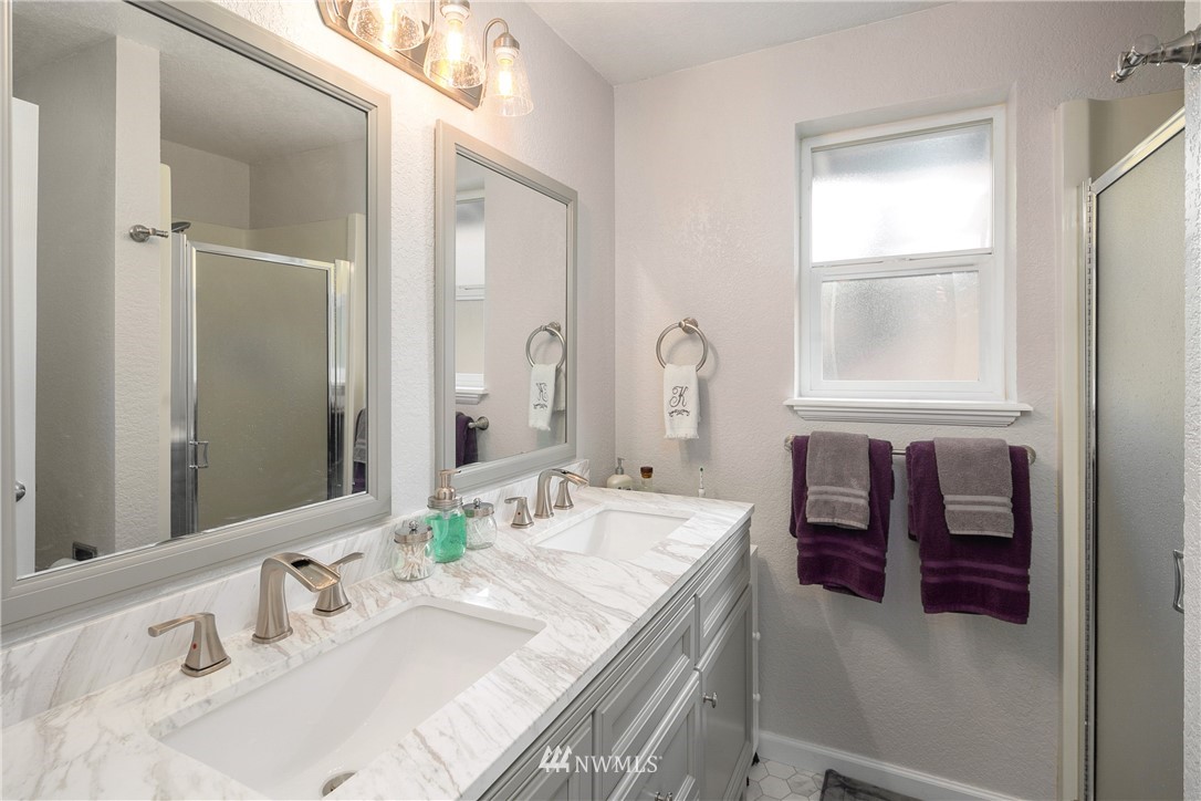 2329 169th Place Southeast Bothell, WA 98012 - Photo 9 of 18 a bathroom with a tub sink and mirror