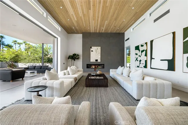 a large kitchen with stainless steel appliances granite countertop a lot of counter space