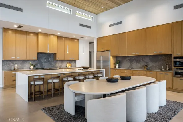 a bedroom with furniture and a wooden floor