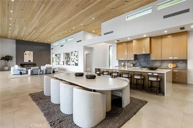 a living room with fireplace furniture and a flat screen tv