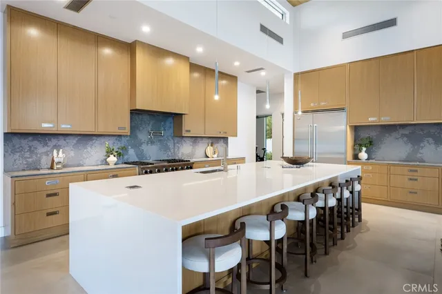 a spacious bedroom with a bed and a table