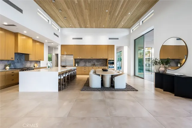 a view of a livingroom with furniture and a potted plant