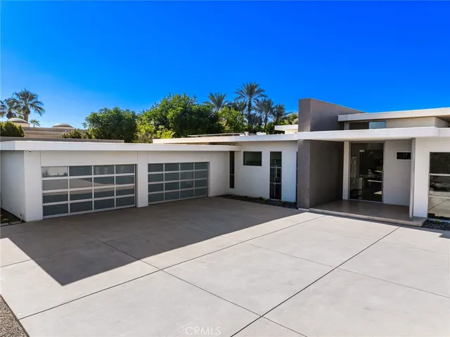 a bed room with couch and a large window