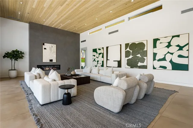 a kitchen with lots of counter top space a sink appliances and cabinets