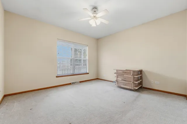 a kitchen with stainless steel appliances granite countertop a refrigerator a sink and a stove