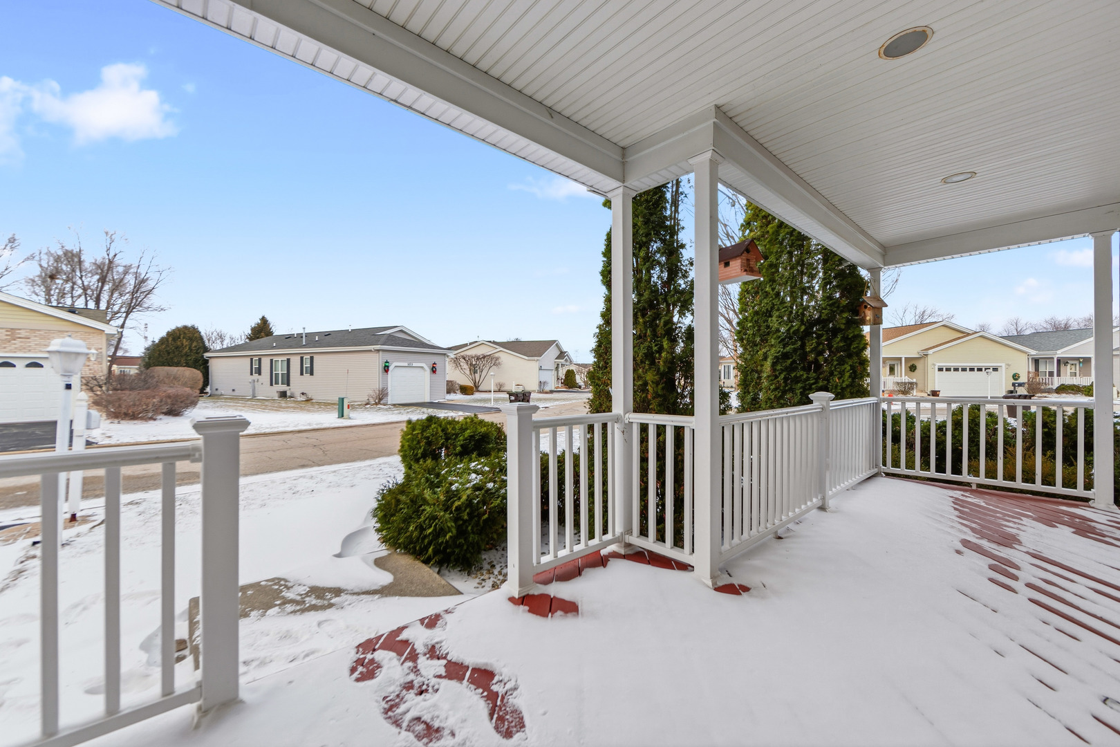 102 Hitching Post Lane Grayslake, IL 60030 - Photo 32 of 64 a view of a porch with wooden fence