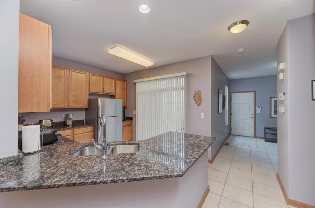 1846 Keystone Place Schaumburg, IL 60193 - Photo 11 of 30 a view of a kitchen with a sink refrigerator and cabinets