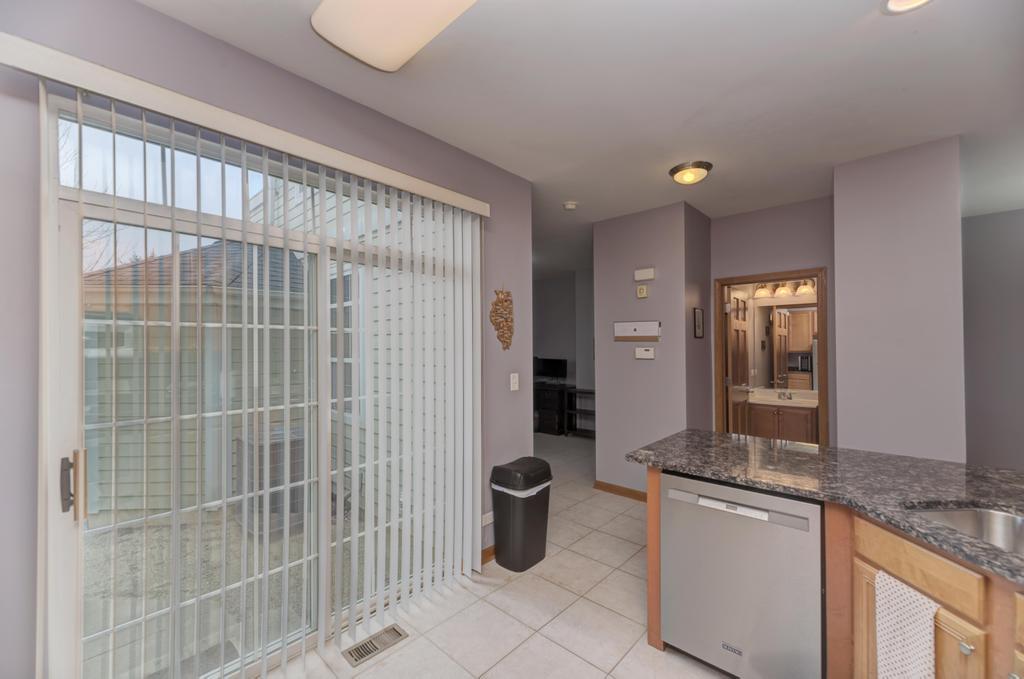 1846 Keystone Place Schaumburg, IL 60193 - Photo 12 of 30 a bathroom with a granite countertop sink a toilet and shower