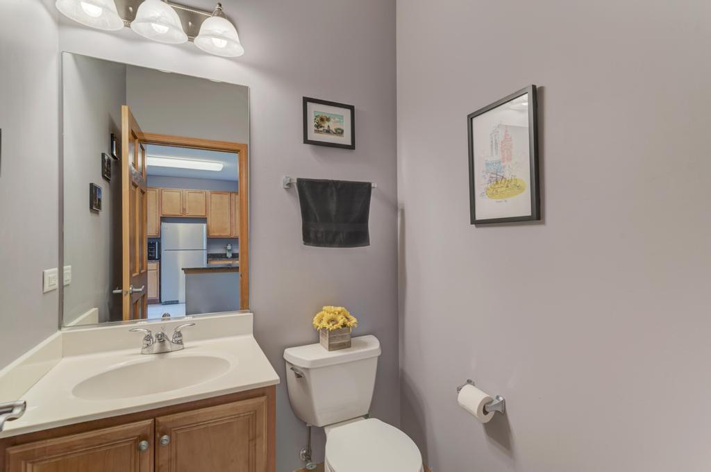 1846 Keystone Place Schaumburg, IL 60193 - Photo 16 of 30 a bathroom with a toilet a sink and mirror