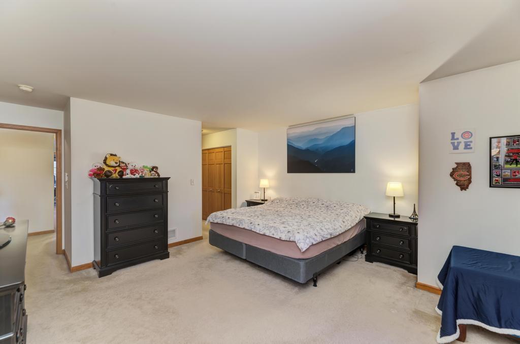 1846 Keystone Place Schaumburg, IL 60193 - Photo 19 of 30 a spacious bedroom with a bed and dresser