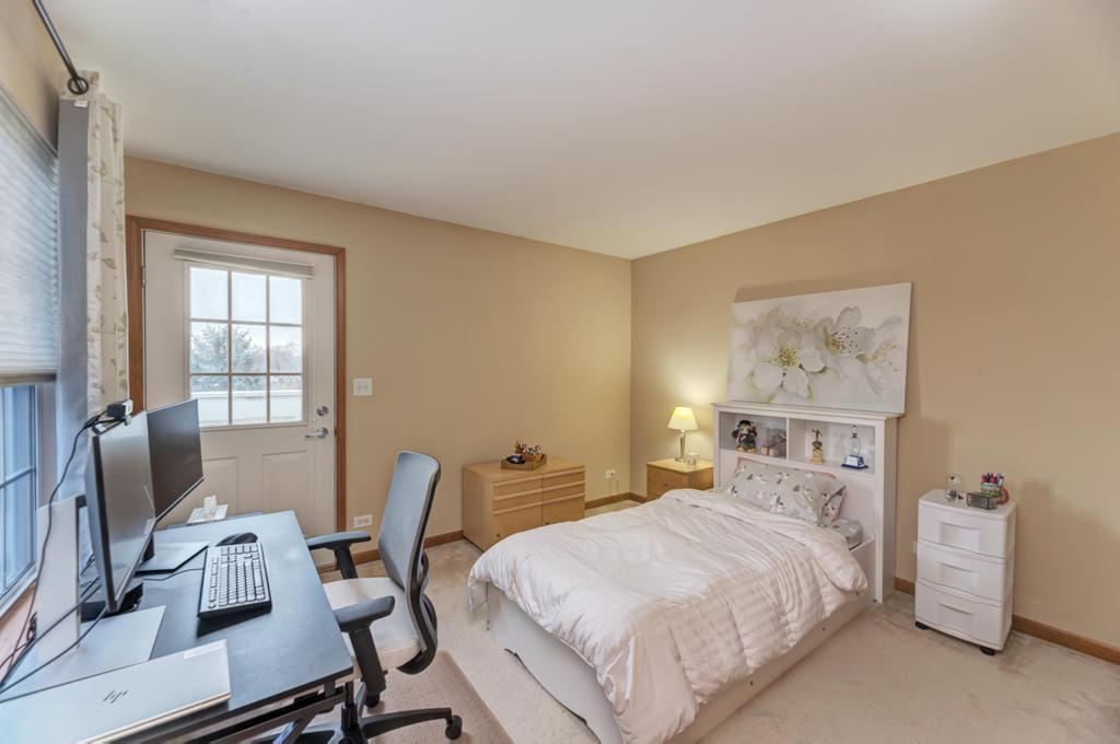 1846 Keystone Place Schaumburg, IL 60193 - Photo 24 of 30 a bedroom with a bed and a desk