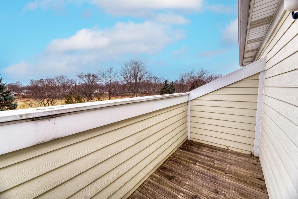 1846 Keystone Place Schaumburg, IL 60193 - Photo 26 of 30 a view of a balcony with wooden floor and city view