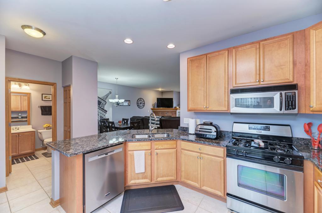 1846 Keystone Place Schaumburg, IL 60193 - Photo 9 of 30 a kitchen with stainless steel appliances granite countertop a stove and a sink