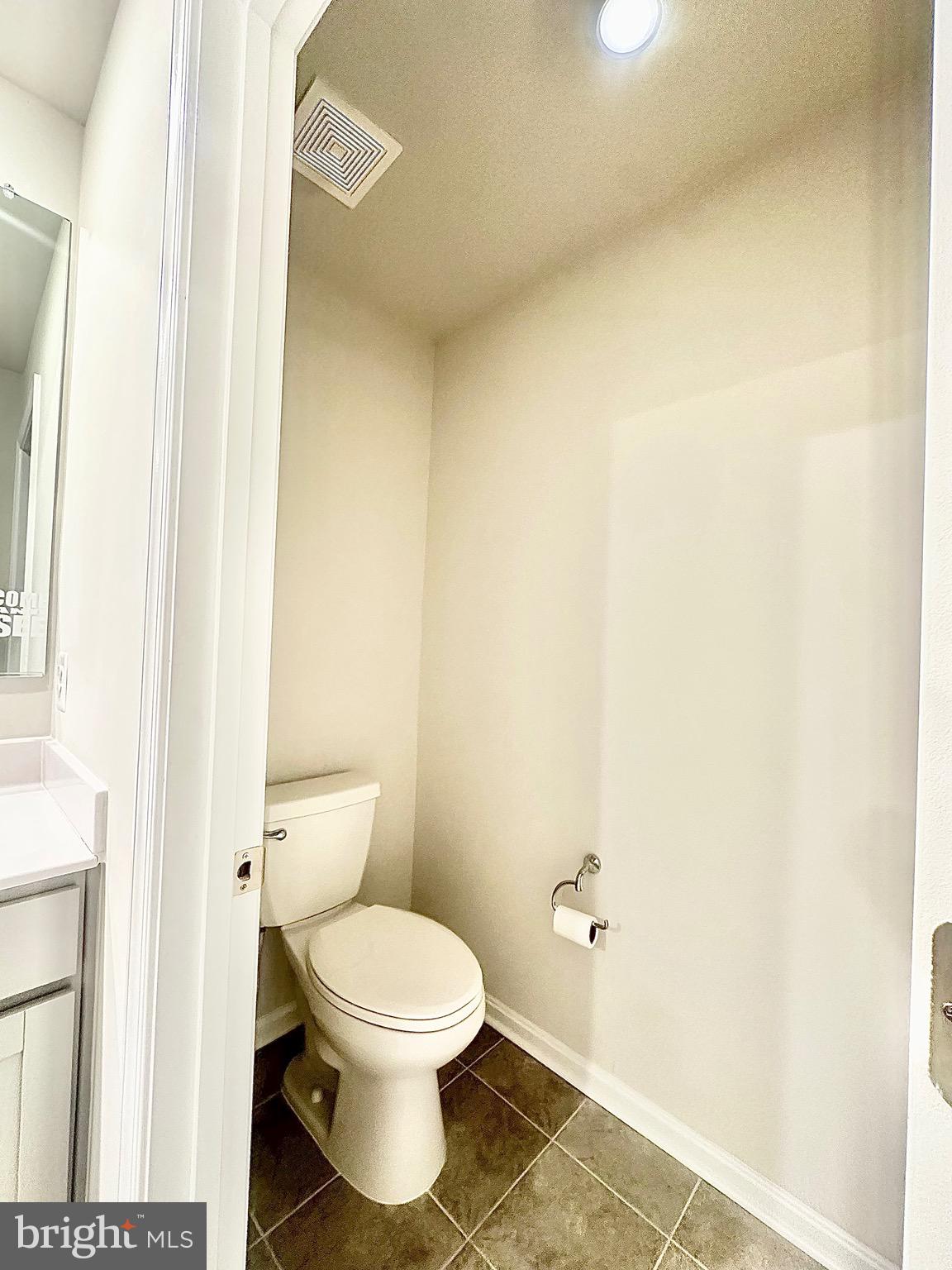 153 Telluride Way Charles Town, WV 25414 - Photo 11 of 21 a white toilet sitting next to a white sink