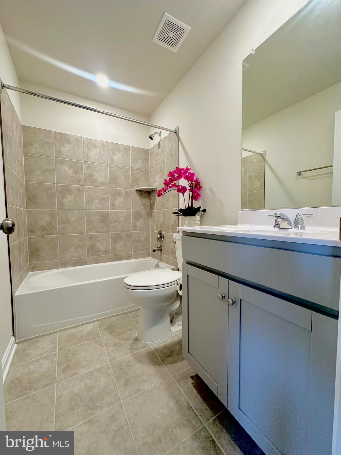 153 Telluride Way Charles Town, WV 25414 - Photo 16 of 21 a bathroom with a sink vanity mirror bathtub shower and toilet