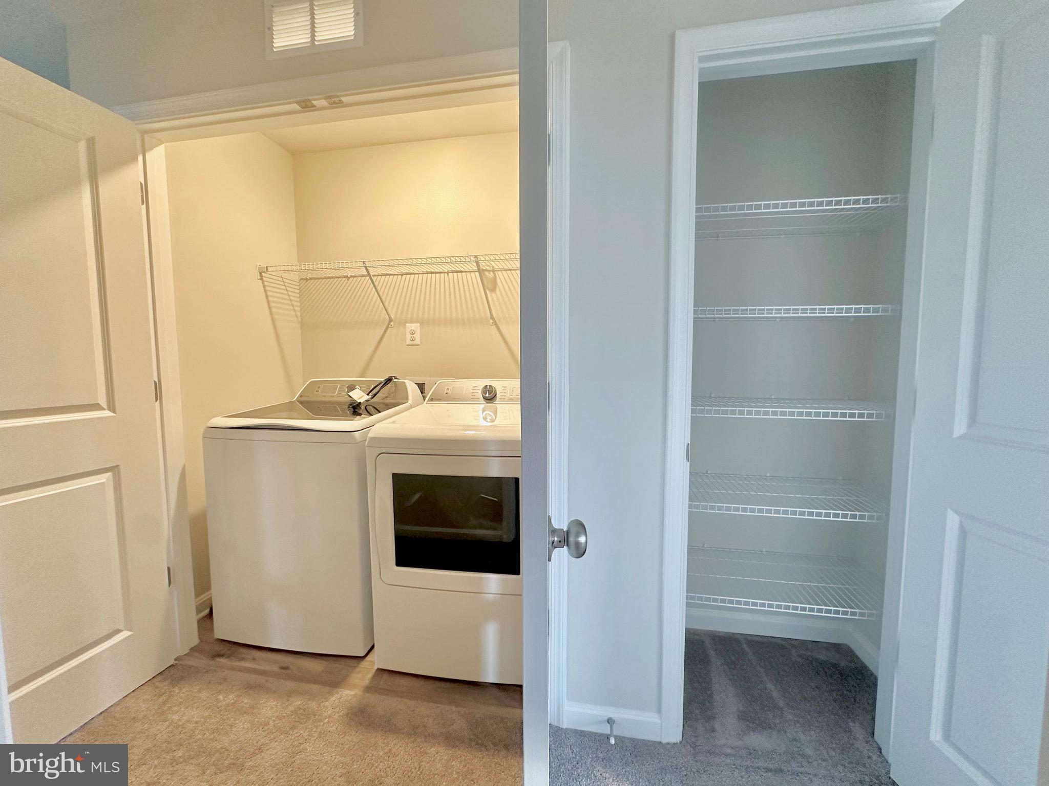 153 Telluride Way Charles Town, WV 25414 - Photo 17 of 21 a utility room with washer and dryer