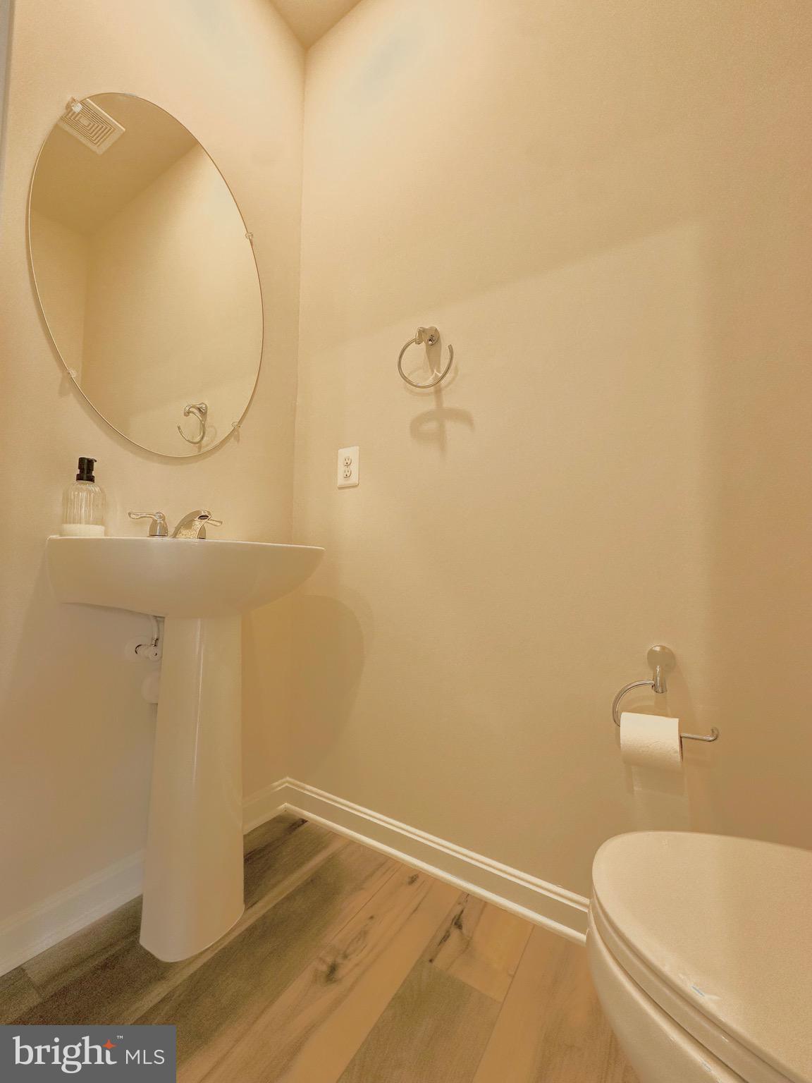 153 Telluride Way Charles Town, WV 25414 - Photo 19 of 21 a bathroom with a sink and a mirror