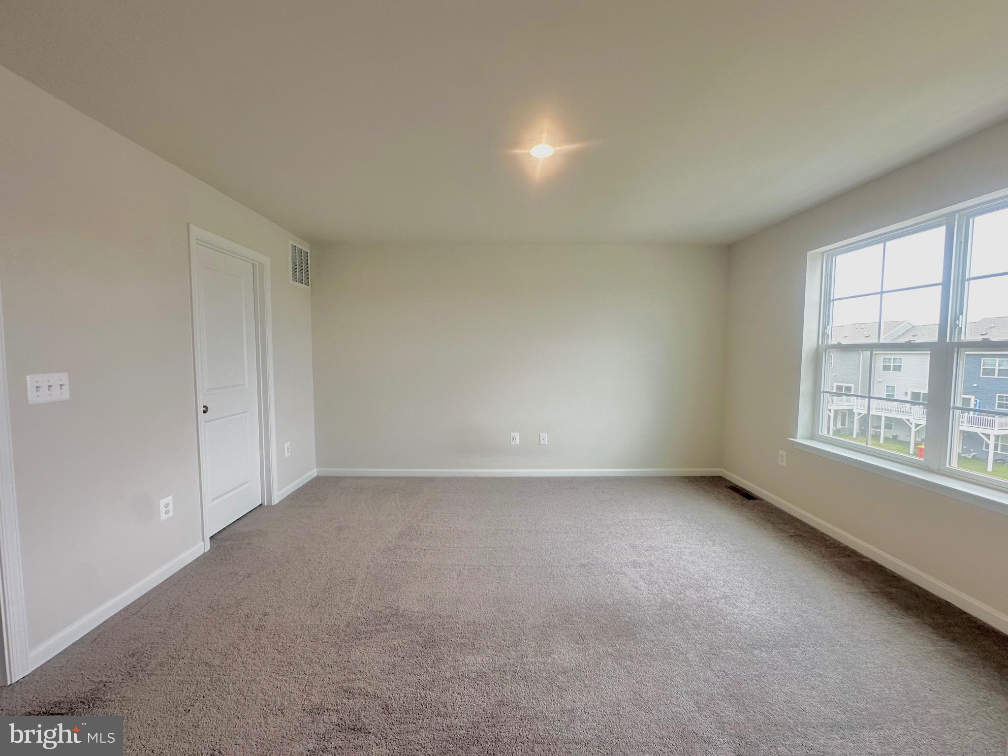 153 Telluride Way Charles Town, WV 25414 - Photo 6 of 21 an empty room with a window