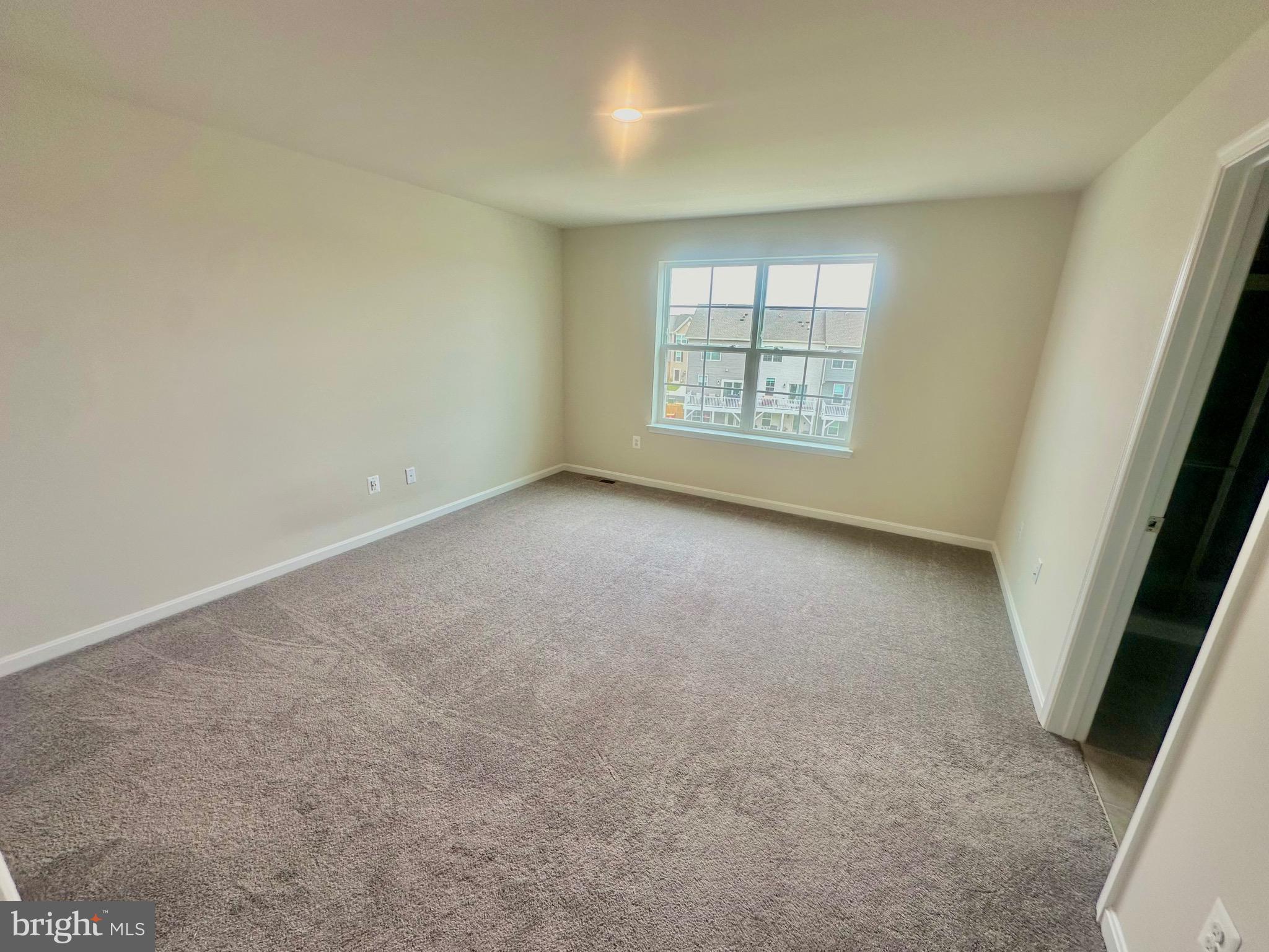 153 Telluride Way Charles Town, WV 25414 - Photo 7 of 21 an empty room with windows
