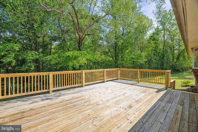 a balcony with view of trees in the background