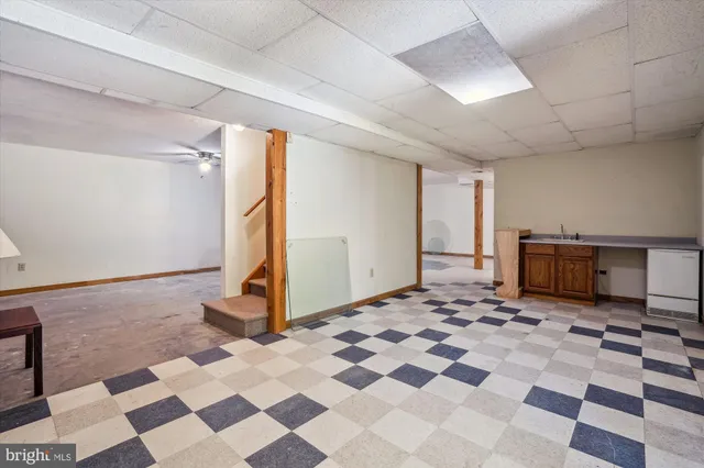 a very nice looking room with a large window and a rug