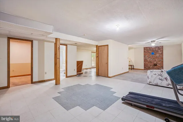 a living room with furniture and large window