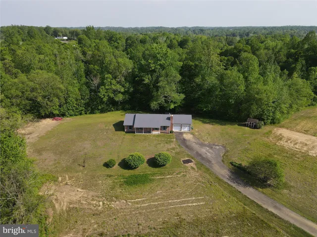 a view of a pool with a yard