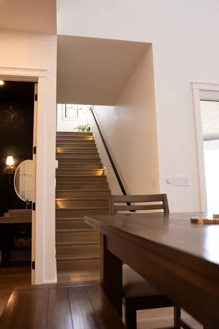 a view of entryway and hall with wooden floor