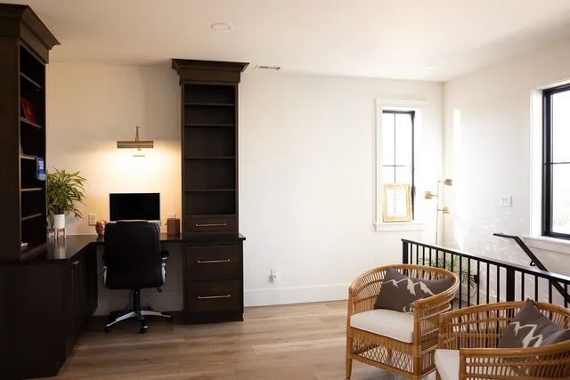 a bedroom with furniture and a window