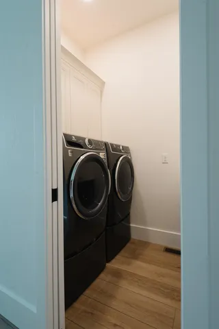 a roof deck with a couch and chairs