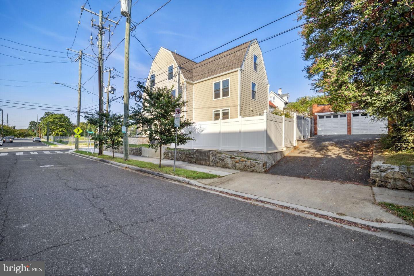 901 Lawrence Street Northeast Washington, DC 20017 - Photo 1 of 15 a front view of a house with a yard and garage