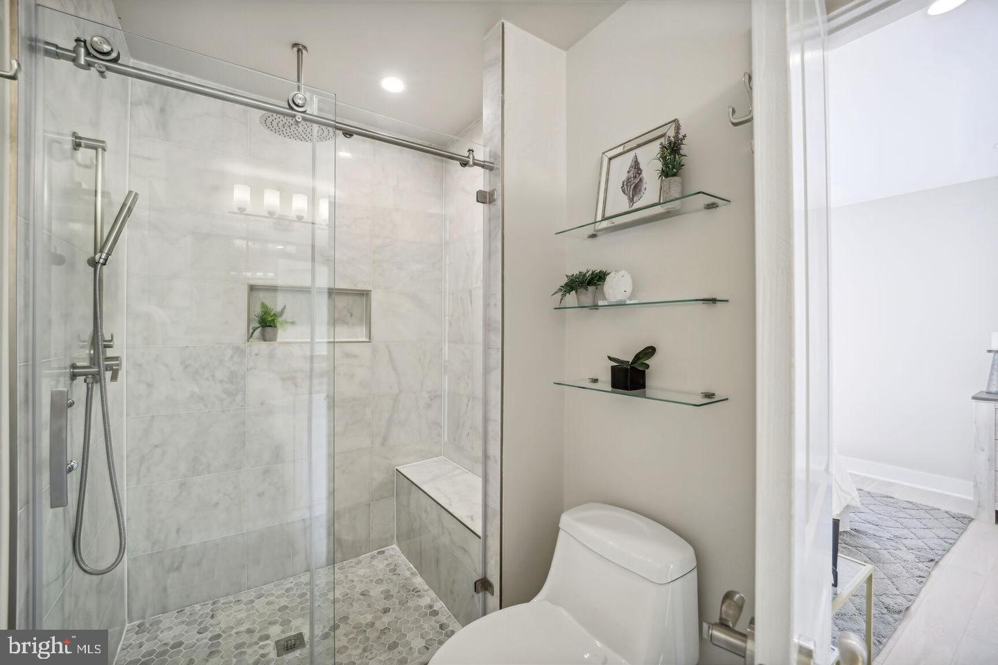 901 Lawrence Street Northeast Washington, DC 20017 - Photo 13 of 15 a bathroom with a shower and toilet