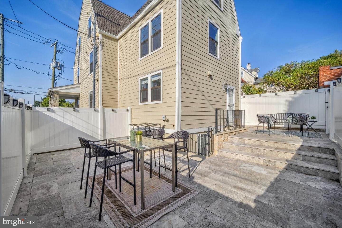 901 Lawrence Street Northeast Washington, DC 20017 - Photo 14 of 15 a view of a patio with couches table and chairs and potted plants