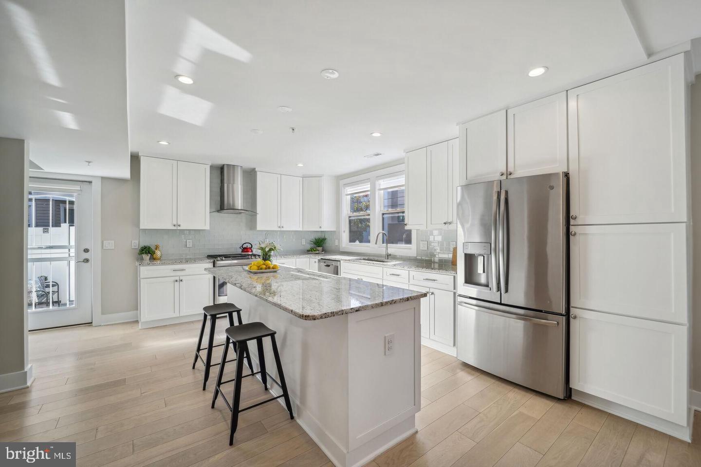 901 Lawrence Street Northeast Washington, DC 20017 - Photo 4 of 15 a kitchen with stainless steel appliances granite countertop a refrigerator and a stove top oven