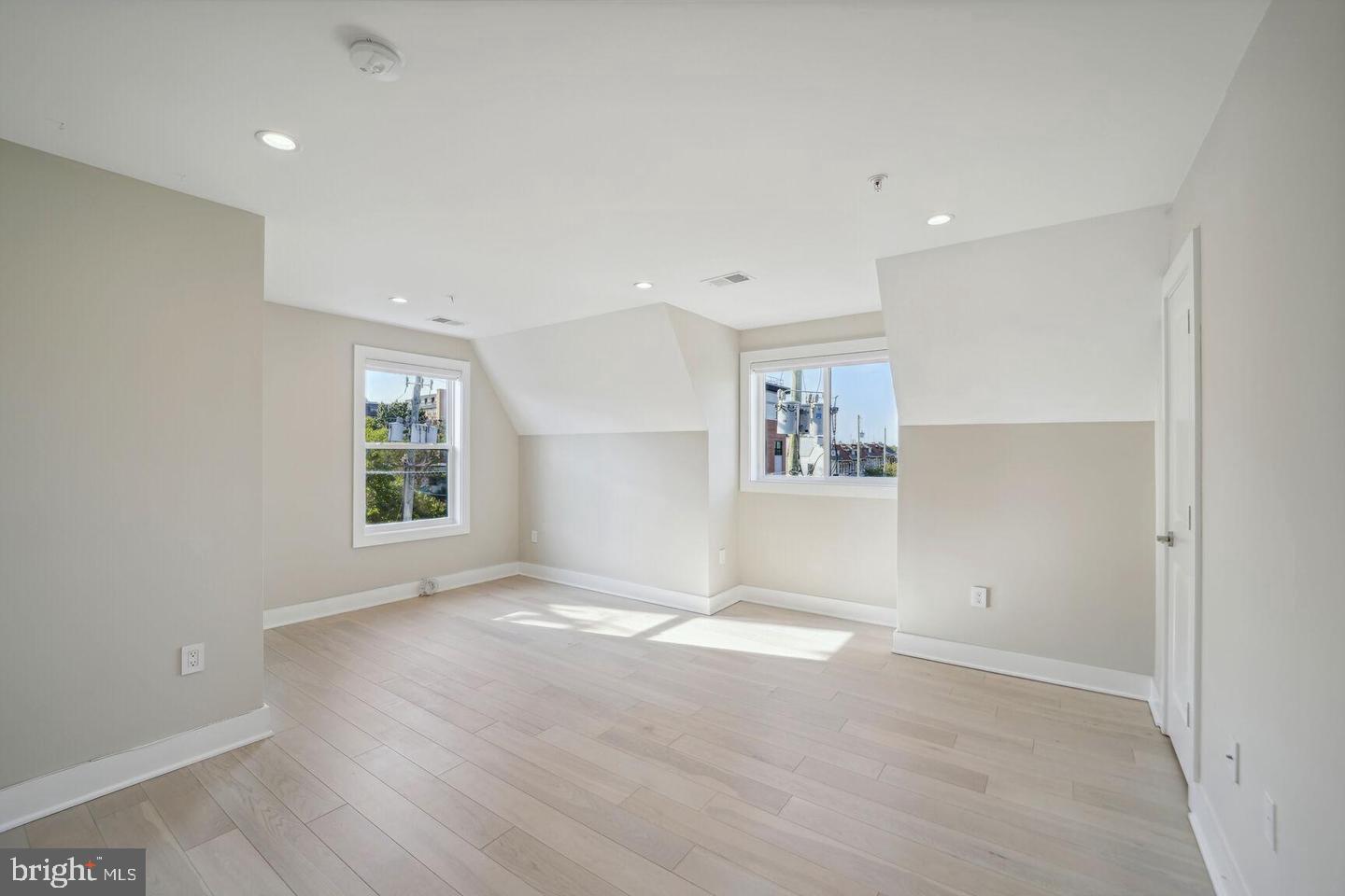 901 Lawrence Street Northeast Washington, DC 20017 - Photo 10 of 15 an empty room with windows and closet
