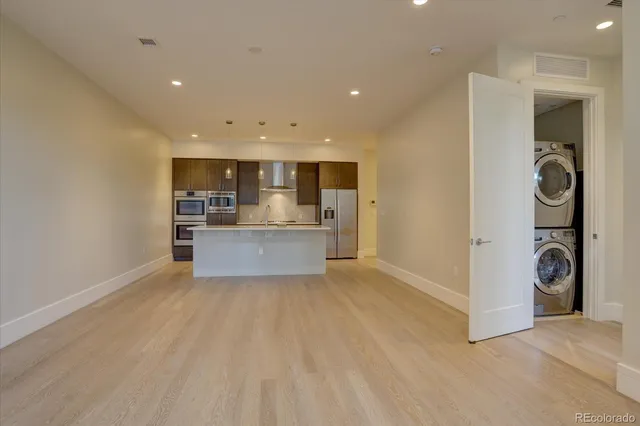 a view of a kitchen with a sink and cabinets