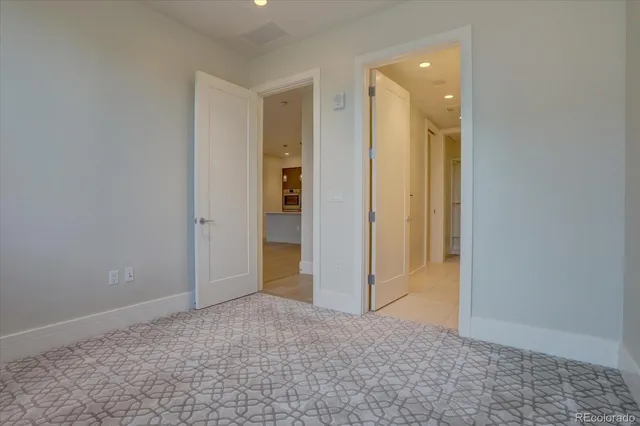 a bathroom with a double vanity sink mirror and shower