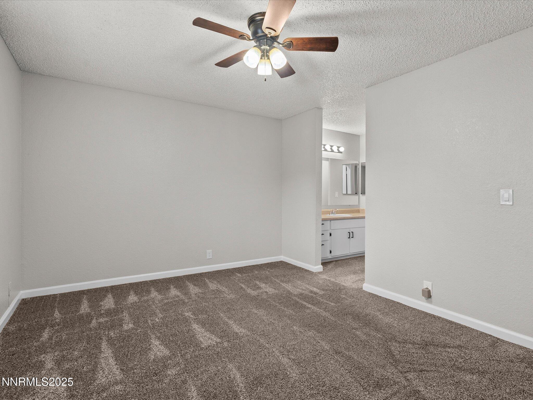 7680 Bluestone Drive, Unit 356 Reno, NV 89511 - Photo 13 of 23 a view of an empty room and a ceiling fan