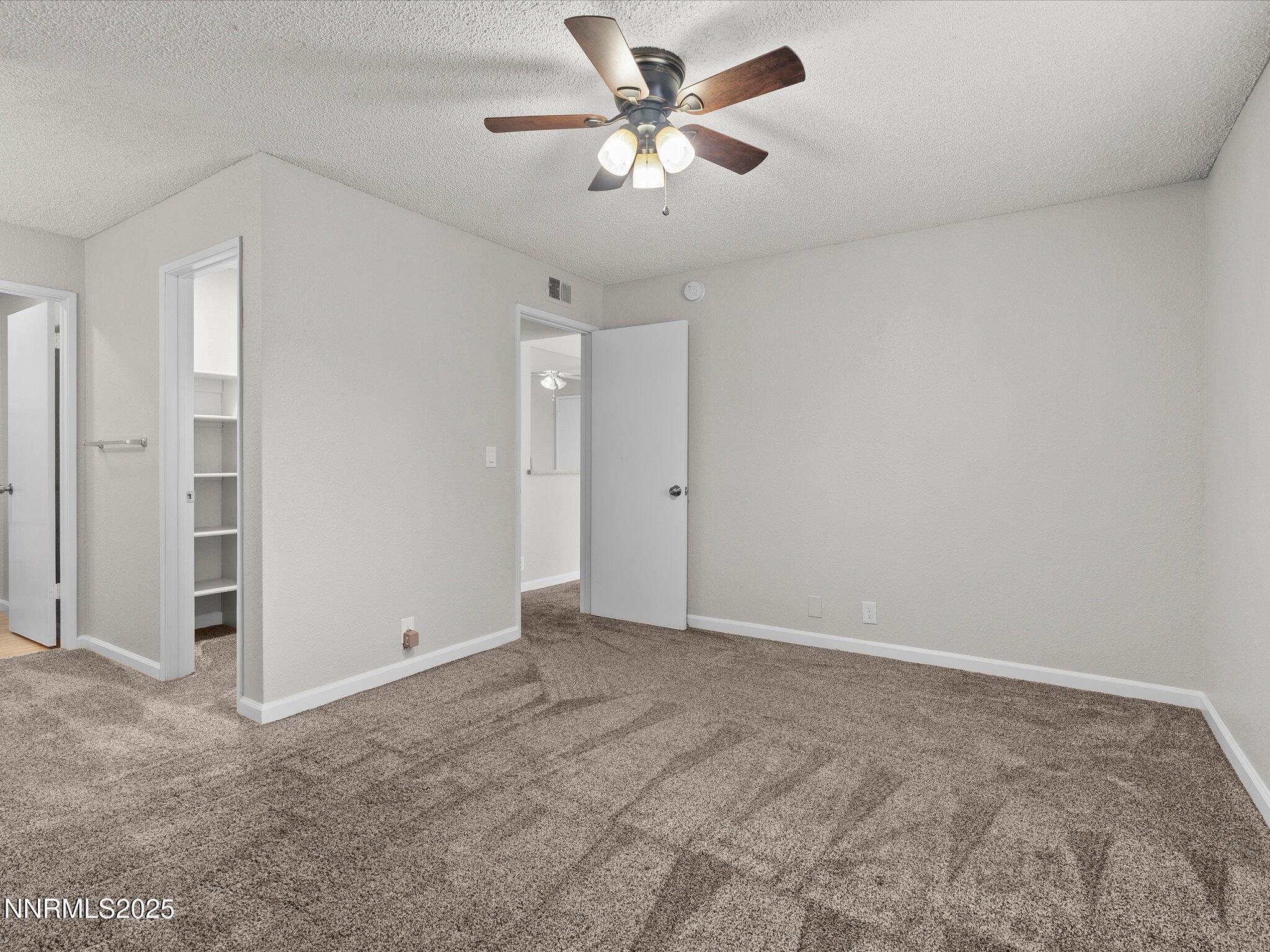 7680 Bluestone Drive, Unit 356 Reno, NV 89511 - Photo 14 of 23 wooden floor in an empty room