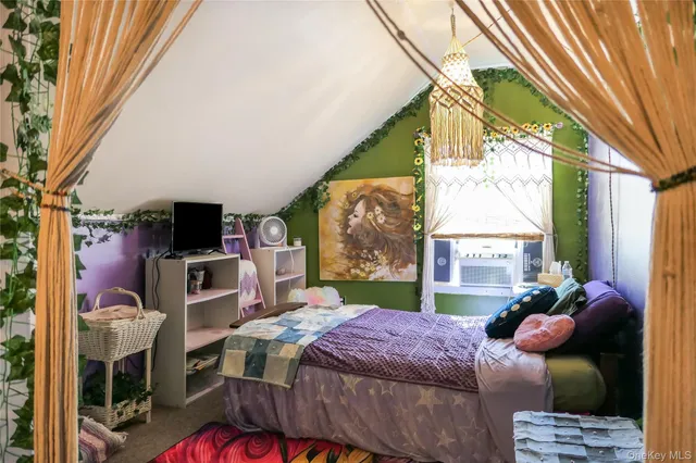 a bedroom with furniture a bed and a window