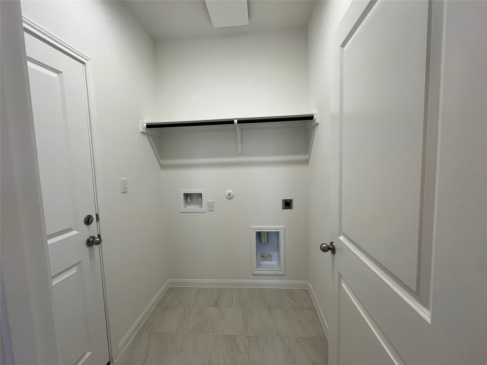 8522 Wellspring Loop Round Rock, TX 78665 - Photo 10 of 36 Laundry room off garage entrance. For demonstration purposes only. This will be the same interior layout. Colors can vary.