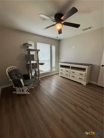 a view of a workspace with furniture and chandelier