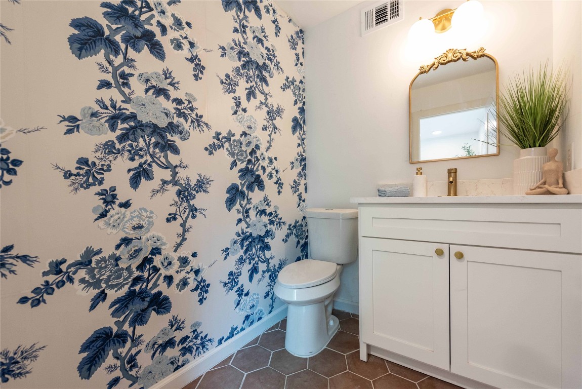 3801 Wilson Street Austin, TX 78704 - Photo 19 of 38 a bathroom with a sink toilet and mirror