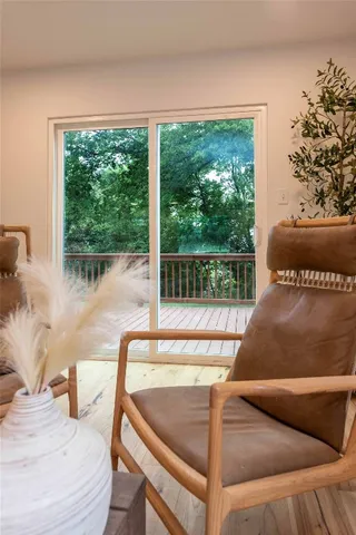 a living room with a couch and a large window