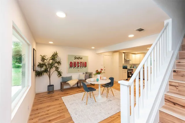 a living room with furniture and a rug