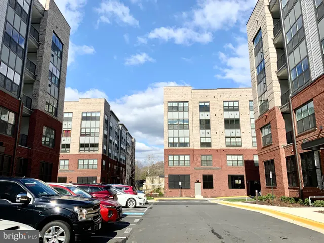 a view of a street that has couple of cars parked on the road