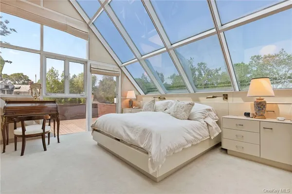 a lobby with furniture and a ceiling fan